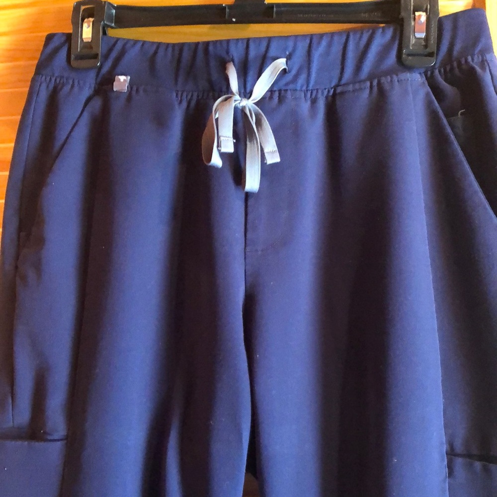 Figs, scrubs, health care workers pants, color navy, size medium.